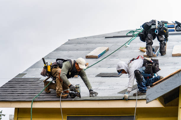 Professional Roofing technician working in Tewksbury, MA